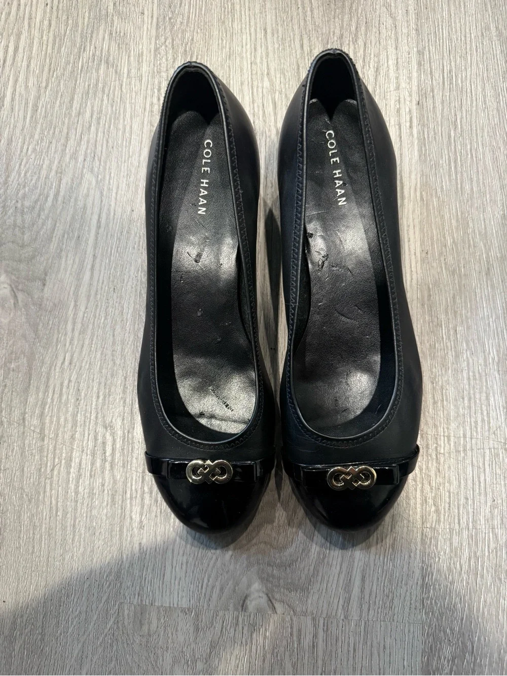 Cole Haan Black Leather Round-Toe Ballet Wedge Heels with Gold Logo Accent